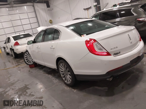 2014 Lincoln MKS with VIN 1LNHL9EK5EG605750, listed as a IAAI auction lot 41565308 with 167,835 mi miles. Bid and sale history available at carsss.com. Image 3.
