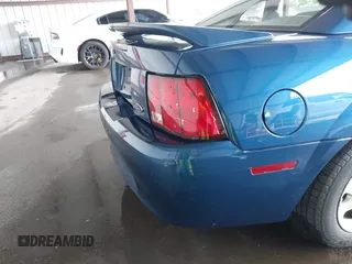 1999 Ford Mustang with VIN 1FAFP4040XF124637, listed as a IAAI auction lot 41793662 with 54,591 mi miles and . Bid and sale history available at DreamBid. Image 6.
