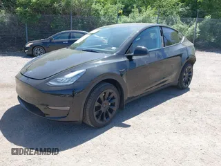 2023 Tesla Model Y Long Range with VIN 7SAYGDEE0PA111430, listed as a IAAI auction lot 42156924 with 35,950 mi miles and . Bid and sale history available at DreamBid. Image 2.