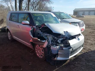 2014 Scion xB with VIN JTLZE4FE2EJ049743, listed as a IAAI auction lot 41668458 with 114,000 mi miles. Bid and sale history available at carsss.com. Image 1.