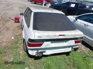 1989 Ford Escort z VIN 1FAPP9591KT185723, wystawiony jako IAAI lot #42257967 z przebiegiem 318 953 mil mil oraz . Historia ofert i sprzedaży dostępna na DreamBid. Obrazek 6.