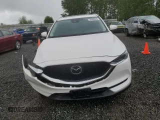 2019 Mazda CX-5 Grand Touring with VIN JM3KFBDM4K0669589, listed as a Copart auction lot 54948455 with 64,475 mi miles and Salvage Title. Bid and sale history available at carsss.com. Image 5.