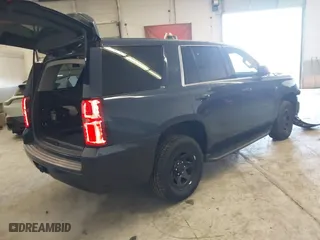 2017 Chevrolet Tahoe Commercial with VIN 1GNLCDECXHR228908, listed as a IAAI auction lot 41537030 with 114,725 mi miles. Bid and sale history available at carsss.com. Image 4.