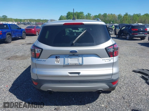 2018 Ford Escape Titanium with VIN 1FMCU9J96JUA33500, listed as a IAAI auction lot 42121736 with 105,430 mi miles and . Bid and sale history available at DreamBid. Image 16.