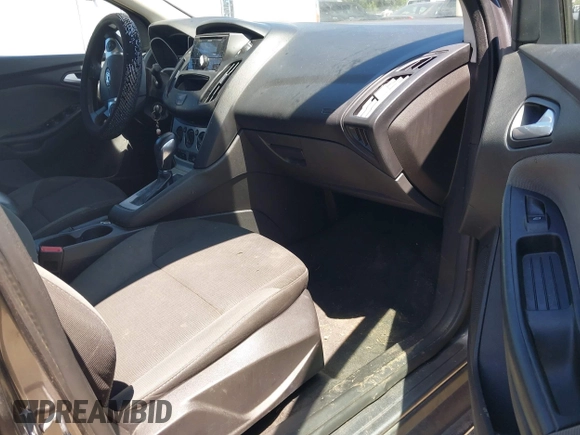 2013 Ford Focus SE z VIN 1FADP3F26DL266821, wystawiony jako IAAI lot #42677519 z przebiegiem 155 238 mil mil oraz . Historia ofert i sprzedaży dostępna na DreamBid. Obrazek 5.