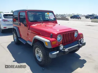 2001 Jeep Wrangler Sport z VIN 1J4FA49S11P375854, wystawiony jako IAAI lot #42334037 z przebiegiem 215 027 mil mil oraz . Historia ofert i sprzedaży dostępna na DreamBid. Obrazek 1.