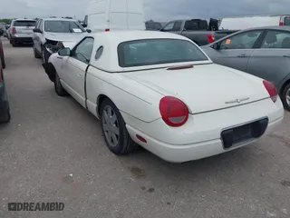2002 Ford Thunderbird w/Hardtop Premium with VIN 1FAHP60A62Y127579, listed as a IAAI auction lot 42035019 with 98,582 mi miles. Bid and sale history available at carsss.com. Image 3.