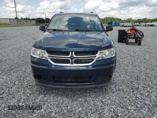 2013 Dodge Journey SE z VIN 3C4PDCAB5DT686890, wystawiony jako Copart lot #58940995 z przebiegiem 148 382 mil mil oraz Czysty tytuł • Clean title. Historia ofert i sprzedaży dostępna na DreamBid. Obrazek 5.