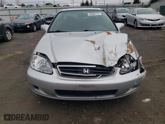 1999 Honda Civic EX z VIN 1HGEJ8242XL042360, wystawiony jako Copart lot #50969175 z przebiegiem 68 734 mil mil oraz Szkoda całkowita • Salvage title. Historia ofert i sprzedaży dostępna na DreamBid. Obrazek 5.