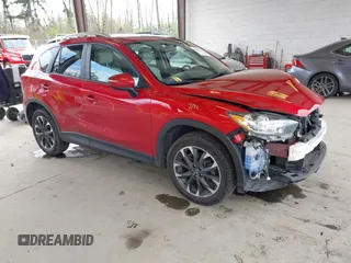 2016 Mazda CX-5 Grand Touring with VIN JM3KE4DY3G0688062, listed as a IAAI auction lot 42025169 with 59,867 mi miles and . Bid and sale history available at carsss.com. Image 1.