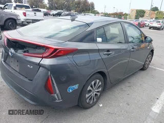 2021 Toyota Prius LE with VIN JTDKAMFP0M3193305, listed as a IAAI auction lot 42283494 with 322,523 mi miles and . Bid and sale history available at DreamBid. Image 4.