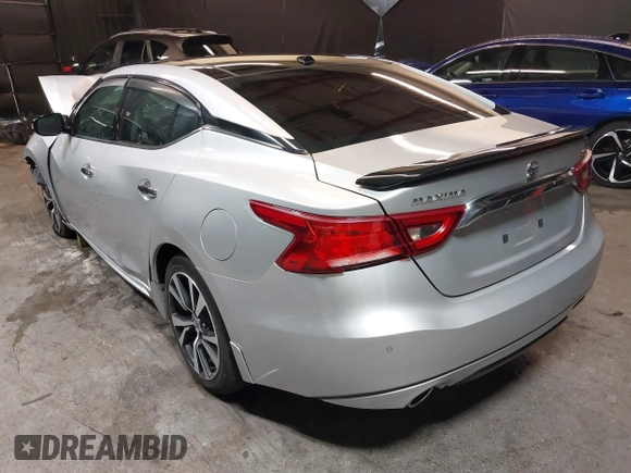 2016 Nissan Maxima SV z VIN 1N4AA6AP4GC415952, wystawiony jako IAAI lot #41806306 z przebiegiem 131 612 mil mil oraz . Historia ofert i sprzedaży dostępna na DreamBid. Obrazek 3.