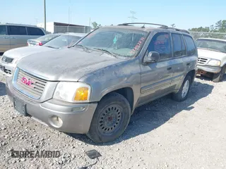 2005 GMC Envoy SLT with VIN 1GKDS13SX52175970, listed as a IAAI auction lot 42047871 with 205,432 mi miles. Bid and sale history available at carsss.com. Image 2.