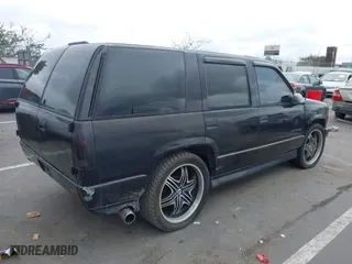 2000 Chevrolet Tahoe Limited with VIN 1GNEC13R7YR151624, listed as a IAAI auction lot 41785878 with 227,576 mi miles. Bid and sale history available at carsss.com. Image 4.