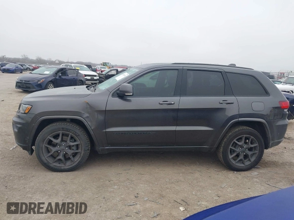 2021 Jeep Grand Cherokee 80th Anniversary z VIN 1C4RJFBGXMC621817, wystawiony jako IAAI lot #41519733 z przebiegiem 60 552 mil mil oraz . Historia ofert i sprzedaży dostępna na DreamBid. Obrazek 14.