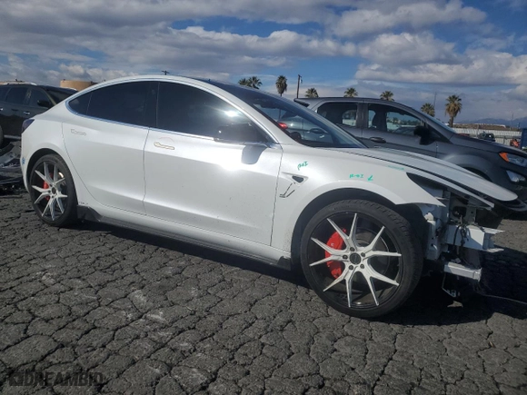 2019 Tesla Model 3 Mid Range with VIN 5YJ3E1EA5KF485617, listed as a Copart auction lot 42179575 with 101,257 mi miles and Salvage Title. Bid and sale history available at carsss.com. Image 4.