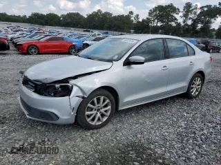 2012 Volkswagen Jetta SE with VIN 3VWDX7AJ1CM389131, listed as a Copart auction lot 64947474 with 140,331 mi miles and Salvage title. Bid and sale history available at DreamBid. Image 1.