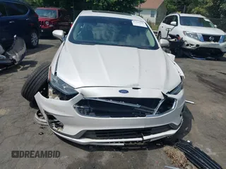 2020 Ford Fusion SE z VIN 3FA6P0LU5LR153942, wystawiony jako IAAI lot #42145638 z przebiegiem 99 961 mil mil oraz . Historia ofert i sprzedaży dostępna na DreamBid. Obrazek 12.