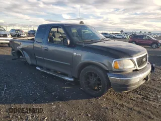 2003 Ford F-150 XL with VIN 1FTRX17L23NA98321, listed as a Copart auction lot 80576014 with 0 mi miles and Salvage Title. Bid and sale history available at carsss.com. Image 4.