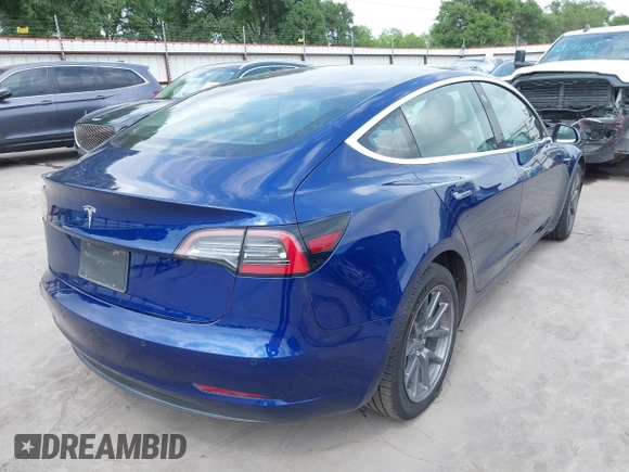 2019 Tesla Model 3 Mid Range with VIN 5YJ3E1EA5KF190453, listed as a IAAI auction lot 41880684 with 58,909 mi miles and . Bid and sale history available at carsss.com. Image 4.