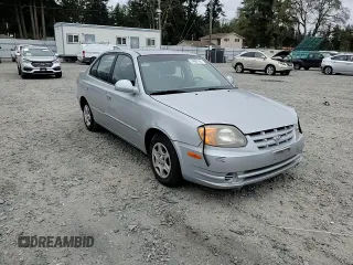 2005 Hyundai Accent GLS z VIN KMHCG45C75U639281, wystawiony jako Copart lot #54887095 z przebiegiem 136 090 mil mil oraz Szkoda całkowita • Salvage title. Historia ofert i sprzedaży dostępna na DreamBid. Obrazek 13.