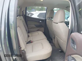2019 GMC Canyon 4WD SLE z VIN 1GTG6CENXK1261278, wystawiony jako IAAI lot #42064295 z przebiegiem 51 786 mil mil oraz . Historia ofert i sprzedaży dostępna na DreamBid. Obrazek 8.