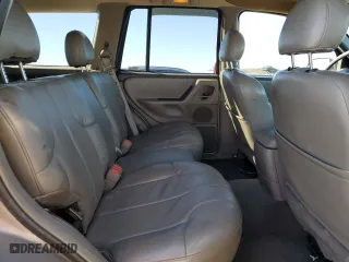 1999 Jeep Grand Cherokee Laredo with VIN 1J4GW58NXXC776438, listed as a Copart auction lot 84412044 with 163,060 mi miles and Salvage Title. Bid and sale history available at carsss.com. Image 11.