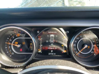 2023 Jeep Wrangler Sport with VIN 1C4HJXDN9PW512460, listed as a Copart auction lot 77107894 with 23,142 mi miles and Salvage Title. Bid and sale history available at DreamBid. Image 9.