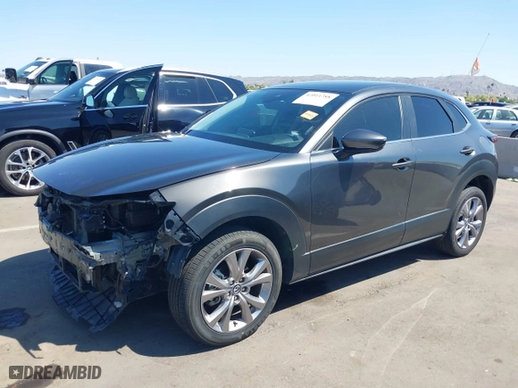 2021 Mazda CX-30 Select with VIN 3MVDMBBL5MM318545, listed as a IAAI auction lot 42011788 with 46,935 mi miles. Bid and sale history available at carsss.com. Image 2.
