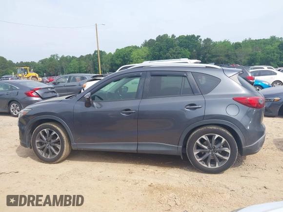 2016 Mazda CX-5 Grand Touring z VIN JM3KE2DY5G0801238, wystawiony jako IAAI lot #42264694 z przebiegiem 136 993 mil mil oraz . Historia ofert i sprzedaży dostępna na DreamBid. Obrazek 13.