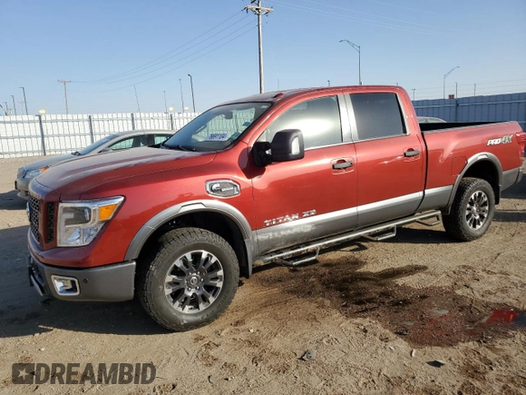 2016 Nissan Titan XD PRO-4X with VIN 1N6BA1F43GN512559, listed as a Copart auction lot 76691104 with 0 mi miles and Salvage Title. Bid and sale history available at carsss.com. Image 1.