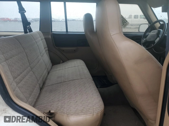 2000 Jeep Cherokee with VIN 1J4FF48S1YL174377, listed as a Copart auction lot 50032345 with 204,234 mi miles and Salvage title. Bid and sale history available at DreamBid. Image 11.