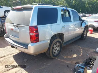 2014 Chevrolet Tahoe LT with VIN 1GNSCBE00ER147899, listed as a IAAI auction lot 42322761 with 299,342 mi miles and . Bid and sale history available at DreamBid. Image 4.