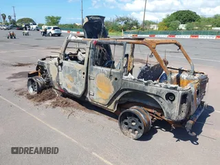 2015 Jeep Wrangler Unlimited Willys Wheeler with VIN 1C4BJWDG0FL751574, listed as a IAAI auction lot 41604064 with Not Provided miles and . Bid and sale history available at DreamBid. Image 3.
