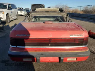 1989 Chrysler LeBaron z VIN 1C3XJ45K0KG251502, wystawiony jako Copart lot #87112404 z przebiegiem 166 445 mil mil oraz Tytuł czysty. Historia ofert i sprzedaży dostępna na DreamBid. Obrazek 6.