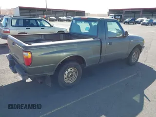 2002 Mazda B-Series 2WD Truck SX with VIN 4F4YR12D32TM21251, listed as a IAAI auction lot 41273974 with 155,165 mi miles. Bid and sale history available at carsss.com. Image 4.