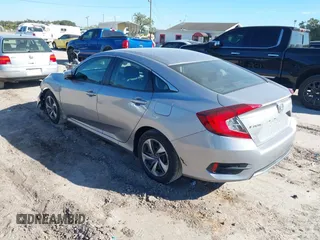 2020 Honda Civic LX with VIN 19XFC2F62LE009433, listed as a IAAI auction lot 40963670 with 117,865 mi miles and . Bid and sale history available at DreamBid. Image 3.