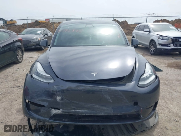 2023 Tesla Model Y Long Range with VIN 7SAYGDEE0PA036048, listed as a IAAI auction lot 41775845 with 41,291 mi miles. Bid and sale history available at carsss.com. Image 11.