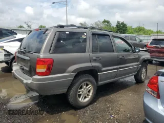 2000 Jeep Grand Cherokee Laredo с VIN 1J4G248S4YC299003, выставлен на аукционе Copart как лот 55937685 с пробегом Не указан миль и Списание • Salvage title. История ставок и продаж доступна на DreamBid. Изображение 3.