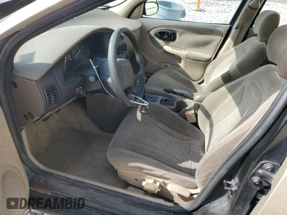 2001 Saturn SL z VIN 1G8ZK52741Z200069, wystawiony jako Copart lot #56360685 z przebiegiem 115 673 mil mil oraz Nie do naprawy. Historia ofert i sprzedaży dostępna na DreamBid. Obrazek 7.
