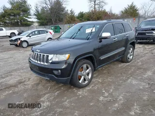2013 Jeep Grand Cherokee Overland with VIN 1C4RJECG5DC621149, listed as a IAAI auction lot 41255140 with 157,355 mi miles. Bid and sale history available at carsss.com. Image 2.