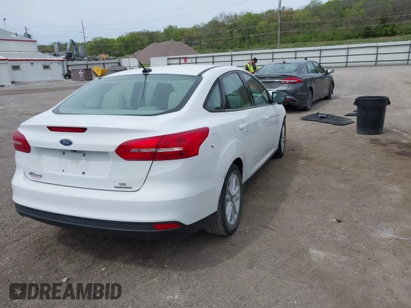 2016 Ford Focus SE with VIN 1FADP3F21GL403121, listed as a IAAI auction lot 42130743 with 103,592 mi miles and . Bid and sale history available at DreamBid. Image 4.