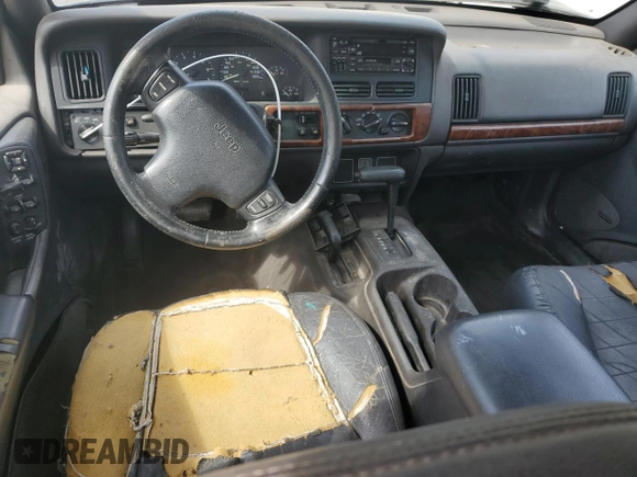 1998 Jeep Grand Cherokee Laredo with VIN 1J4GZ48S7WC222845, listed as a Copart auction lot 59576115 with Not provided miles and Clean title. Bid and sale history available at DreamBid. Image 8.
