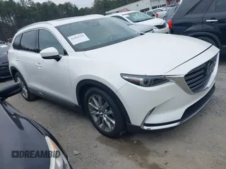 2016 Mazda CX-9 Grand Touring with VIN JM3TCADY0G0113779, listed as a IAAI auction lot 41466750 with 58,035 mi miles and . Bid and sale history available at DreamBid. Image 1.