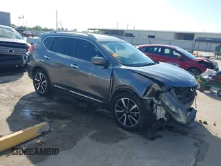 2017 Nissan Rogue SL with VIN 5N1AT2MT2HC859544, listed as a IAAI auction lot 40773928 with 200,265 mi miles and . Bid and sale history available at DreamBid. Image 1.