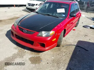 2002 Mazda Protege z VIN JM1BJ245221631014, wystawiony jako IAAI lot #42232912 z przebiegiem 180 184 mil mil oraz . Historia ofert i sprzedaży dostępna na DreamBid. Obrazek 2.