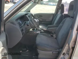 2003 Chevrolet Tracker with VIN 2CNBE13C836953178, listed as a Copart auction lot 60715605 with 128,978 mi miles and Salvage title. Bid and sale history available at DreamBid. Image 7.