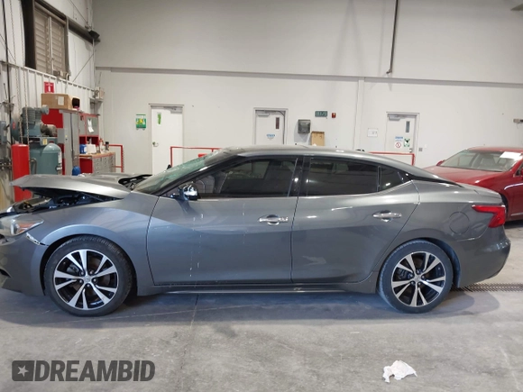 2018 Nissan Maxima SL z VIN 1N4AA6APXJC374220, wystawiony jako IAAI lot #42018130 z przebiegiem 119 776 mil mil oraz . Historia ofert i sprzedaży dostępna na DreamBid. Obrazek 14.