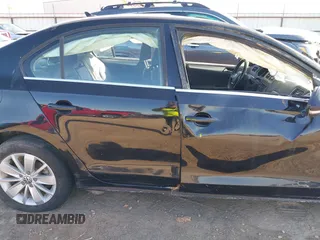 2015 Volkswagen Jetta SE z VIN 3VWD07AJ3FM266598, wystawiony jako IAAI lot #41757080 z przebiegiem 127 815 mil mil oraz . Historia ofert i sprzedaży dostępna na DreamBid. Obrazek 14.