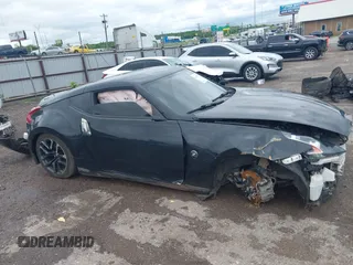 2020 Nissan 370Z Sport z VIN JN1AZ4EH6LM823399, wystawiony jako IAAI lot #42135621 z przebiegiem 98 855 mil mil oraz . Historia ofert i sprzedaży dostępna na DreamBid. Obrazek 14.